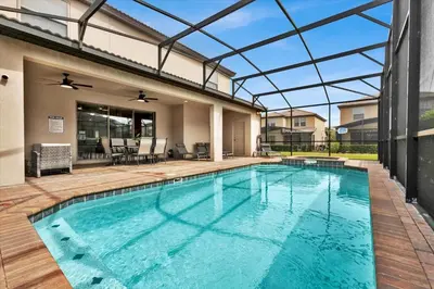 an indoor swimming pool with a glass ceiling at Neverland Nook in Orlando