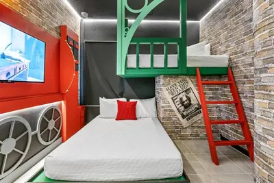 a small room with a bunk bed and a ladder at 2026 Luxury 5Bedrooms At Paradiso Grande in Orlando