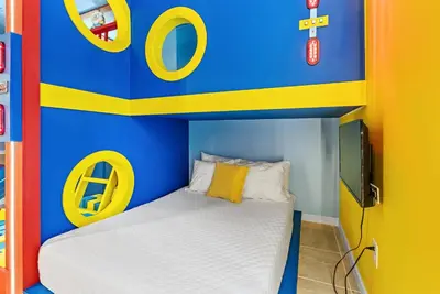 a childs bedroom with a bed in a lego room at 2026 Luxury 5Bedrooms At Paradiso Grande in Orlando