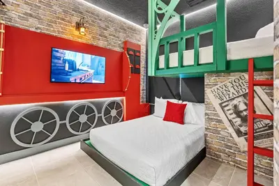 a bedroom with a bunk bed and a tv at 2026 Luxury 5Bedrooms At Paradiso Grande in Orlando