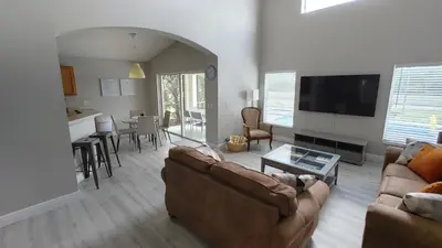 a living room with a couch and a table at Magnificent View-Close to Disney in Kissimmee