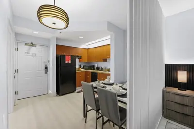 a kitchen and dining room with a table and chairs at Orlando 2BR Apt Full Kitchen Epic Universe in Orlando