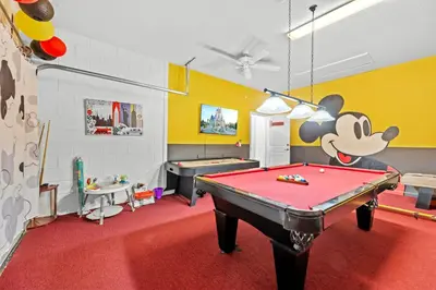 a play room with a pool table in it at Pool 4BR Resort Home Near Disney in Kissimmee
