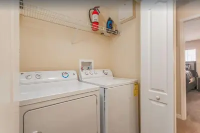 a laundry room with a washer and dryer at Disney & Resort Fun Private Pool Renovated in Kissimmee