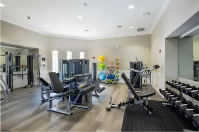 a gym with cardio equipment and treadmills at 3 Bedrooms 2 Bathrooms Vista Cay 4814-405 Ca in Orlando