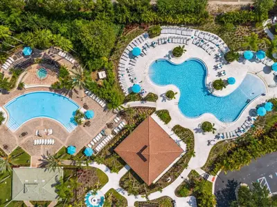 an overhead view of a pool at a resort at 3 Bedrooms 2 Bathrooms Vista Cay 4814-405 Ca in Orlando