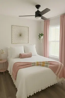 a bedroom with a large bed with a ceiling fan at Once upon a good stay - 7 Beds Pool Home by Disney in Kissimmee