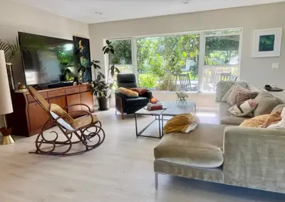 a living room with a couch and a chair at Chic & Stylish 3BR-2BA Nature Lovers Home in Orlando