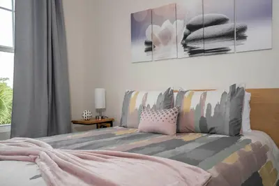 a bedroom with a bed and a window at New Vacay Home 5BD 5BA - 5 miles to Disney in Orlando