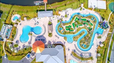 an overhead view of a pool at a resort at 4BR-3BA Townhouse with Private Pool in Storey Lake in Kissimmee