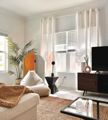 a living room with a couch and a tv at Last Minute Disney Luxury Townhouse with Private Pool. Book Now SLR557 in Kissimmee
