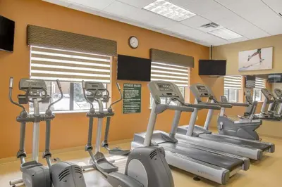 a gym with several cardio machines in a room at Near Orlando Convention center and all Park's in Orlando