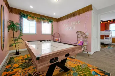 a ping pong room with a ping pong table at Family Escape | Moana Vibes | Pool + Games in Orlando