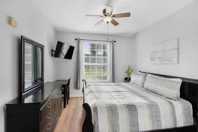 a bedroom with a bed and a ceiling fan at 2302 Butterfly Palm 102 in Kissimmee