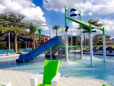 a water park with a slide in the water at 4 Bed Private Yard-Pool Home in Kissimmee