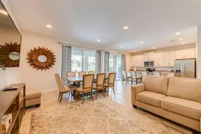 a living room with a couch and a table and chairs at RVH7391 - Five Bed Luxury Disney Vacation Retreat in Orlando