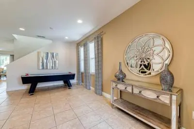 a living room with a piano and a pool table at RVH7391 - Five Bed Luxury Disney Vacation Retreat in Orlando