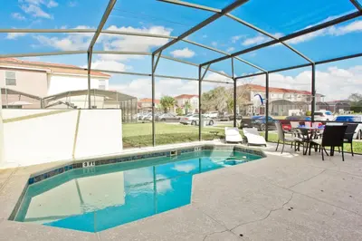 a swimming pool with a tent and a table and chairs at Plunge Pool Oasis Bella Vida Resort Close to Parks in Kissimmee