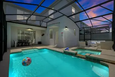 a swimming pool with a ball in a house at Family Pool Villa I Near Disney I 2 Free Clubhouses in Kissimmee