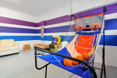 a room with a basketball hoop in a room at Magical Getaway Near Disney I Pool and Fun Room in Orlando