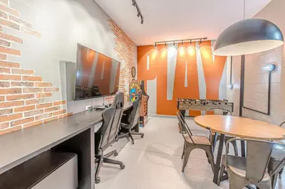 a room with a table and chairs and a tv at 2807 - Storybook Escape in Kissimmee