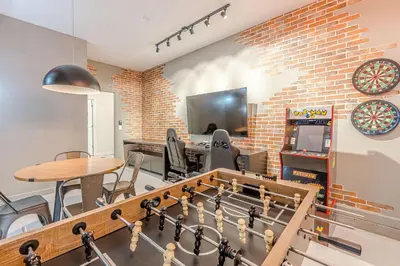 a room with a foosball table and a game room at 2807 - Storybook Escape in Kissimmee