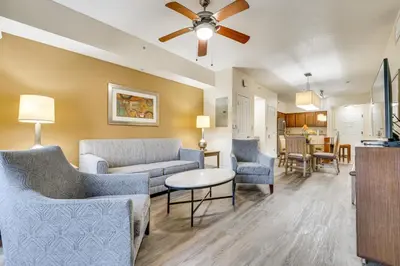 a living room with furniture and a ceiling fan at Floridays Resort Condo 11 Mi to Walt Disney World! in Orlando