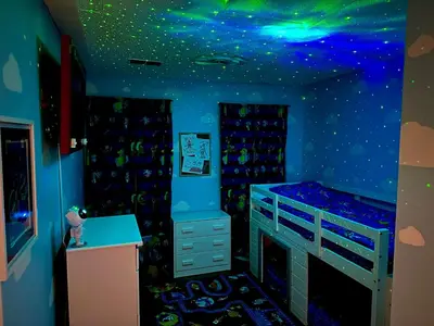 a room with a bed with a starry ceiling at Magic Getaway at Emerald Island in Kissimmee