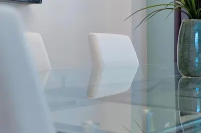 a glass table with two vases on top of it at 2616 TRANQUILITY KISSIMMEE 6 BED in Kissimmee
