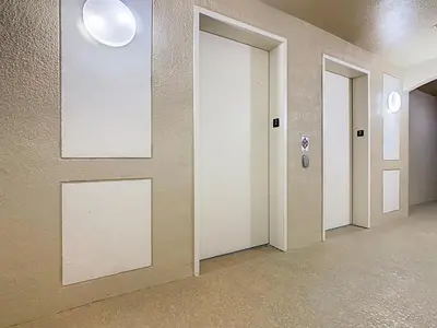an empty hallway with three doors in a building at Windsor Hills 3BR - Mickey Themed Spacious Condo in Orlando