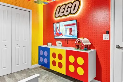 a lego room with a table and a tv at Amazing 05 Bedrooms At Storey Lake in Kissimmee