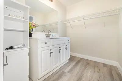 a white bathroom with a sink and a shower at 2050 E IRLO BRONSON 1BED in Kissimmee