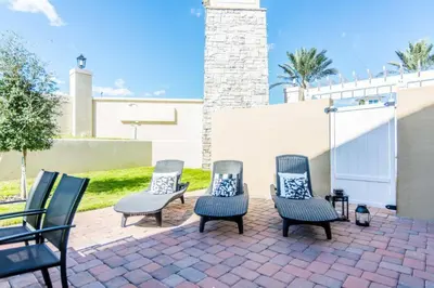 a group of chairs sitting on a brick patio at Magic 5bd House 8 min from Disney in Orlando