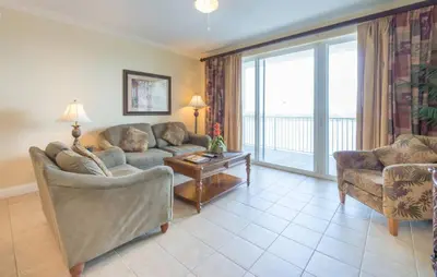 a living room with two couches and a large window at Disney Dream Condo & Lake View Awaits in Orlando