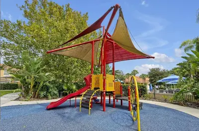 a playground with a slide in a park at 8567 BAY LILY LOOP 3 BED in Kissimmee