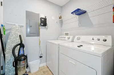 a white washer and dryer in a laundry room at 8567 BAY LILY LOOP 3 BED in Kissimmee