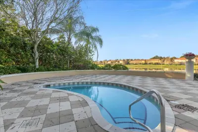 a swimming pool in a patio with a tile floor at 3 Bedrooms 3 Bathrooms Encantada Resort 3097Yl in Kissimmee