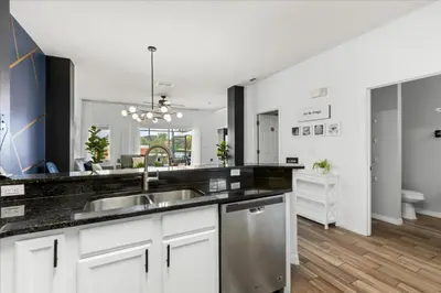 a kitchen with white cabinets and a sink at 3 Bedrooms 3 Bathrooms Encantada Resort 3097Yl in Kissimmee