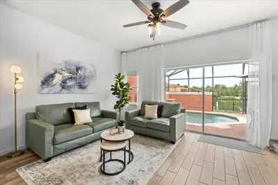 a living room with a couch and a ceiling fan at 3 Bedrooms 3 Bathrooms Encantada Resort 3097Yl in Kissimmee