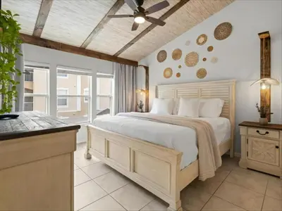 a bedroom with a large bed with a ceiling fan at 3 Bedrooms 3 Bathrooms Windsor Palms 2318Sp in Kissimmee