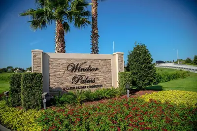 a sign for a vacation home with palm trees and flowers at 3 Bedrooms 3 Bathrooms Windsor Palms 2318Sp in Kissimmee