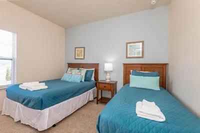 a bedroom with two beds and a window at TVPM-3230WA in Kissimmee
