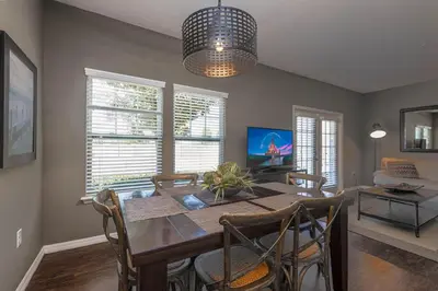 a dining room with a wooden table and chairs at TVPM-3230WA in Kissimmee