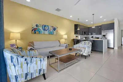 a living room with a couch and chairs and a table at 1617 Retreat Circle Clermont 3 BED in Orlando