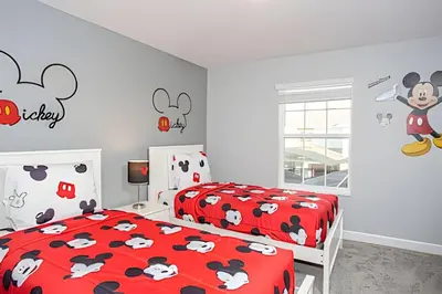 a bedroom with two beds with mickey mouse decals on the wall at Casa 4 Quartos c/ Piscina Privativa - Disney in Kissimmee