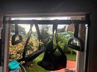 a group of umbrellas hanging in a window at Family retreat with lake views and near Disney in Saint Cloud