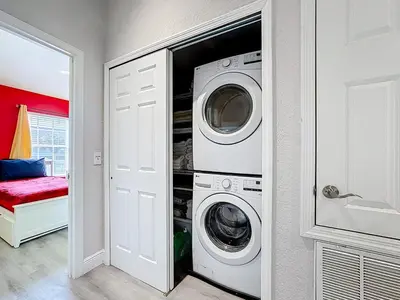 a laundry room with a washer and dryer at T2531M Windsor Hills Resort 3Bedrm Private Pool in Orlando