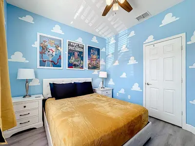 a bedroom with a bed with blue walls and clouds at T2531M Windsor Hills Resort 3Bedrm Private Pool in Orlando
