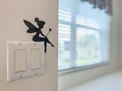 a white light switch with a fairy on it at 2888 OAKWATER KISSIMMEE 3BEDS in Orlando