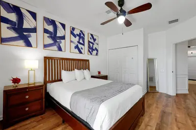 a bedroom with a bed and a ceiling fan at Beautiful Epic Universe Townhome, Vista Cay-4034 in Orlando